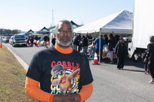Lane Harper, executive director of the Power of Life Foundation and an officer with the Birmingham Police Department (BPD) during the Foundation’s Fifth Annual Thanksgiving Turkey Giveaway in Fultondale, Alabama. (Marika N. Johnson, For The Birmingham Times).