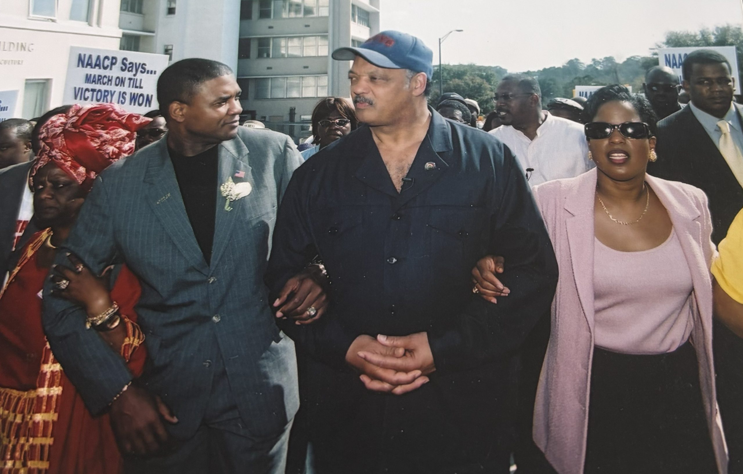 Black Politics Advisory Council member and former Florida State Senator Tony Hill marching with Jesse Jackson