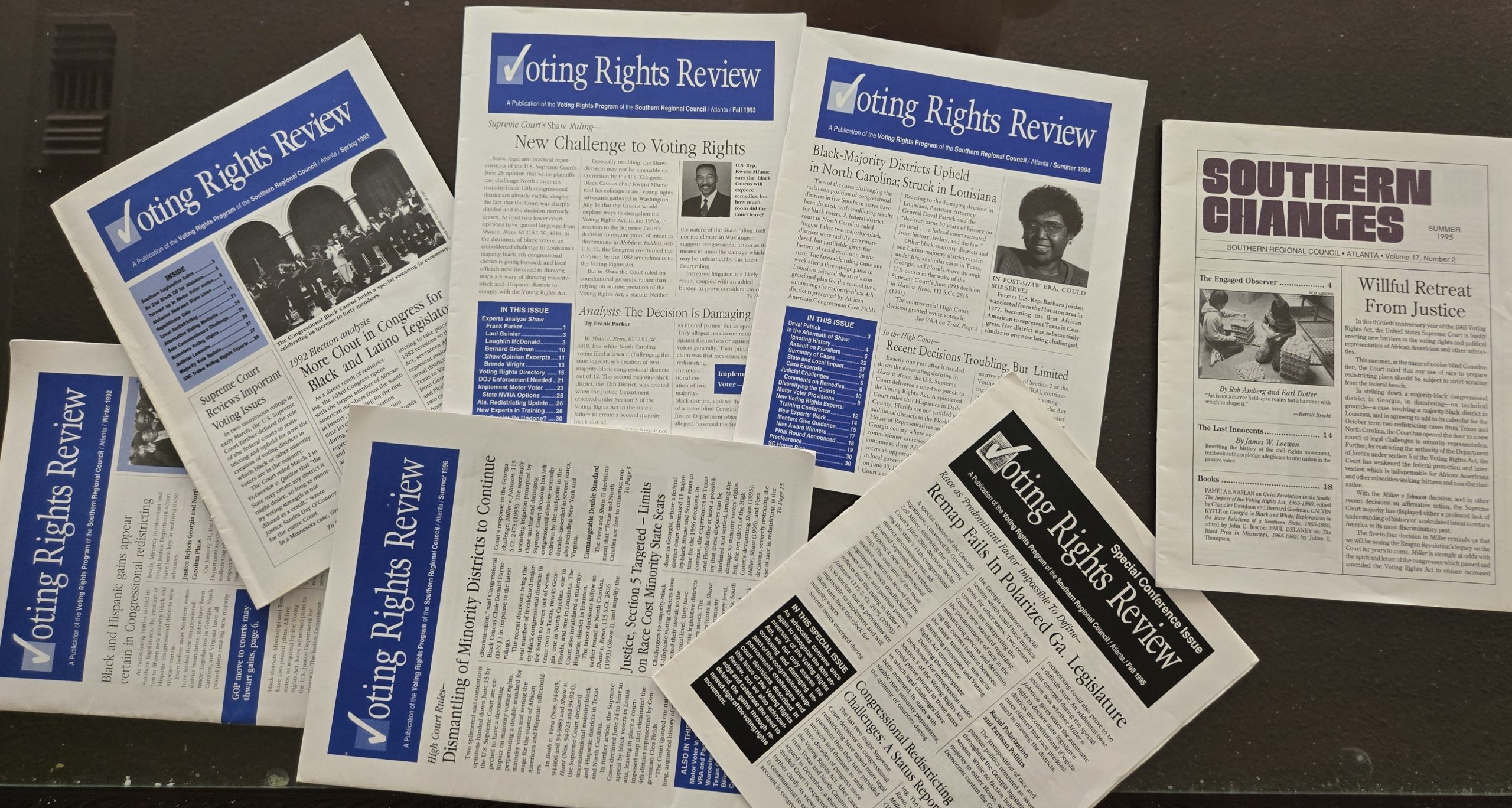 A fan layout of several historic print editions of the "Voting Rights Review" newsletter and one copy of the "Southern Changes" journal, all published by the Southern Regional Council in Atlanta during the 1990s. The covers feature headlines regarding Supreme Court rulings, congressional redistricting, and challenges to majority-Black political power across the American South.